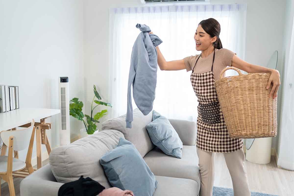 Airbnb host gathering laundry
