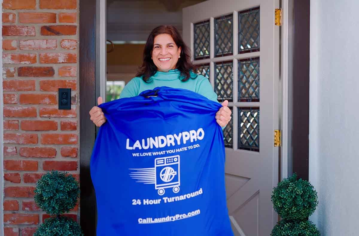 LaundryPro customer holding laundry bag
